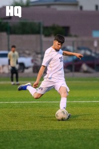 Yahir Mendoza (19) of Rio Grande strikes the ball during the semifinal match of the APS Metro Soccer Championships against Atrisco Heritage Academy.