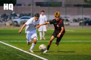 Omar Martinez (11) of Atrisco Heritage Academy and Rio Grande’s Alex Madera (8) battle for possession in the boys’ gold bracket semifinals matchup of the APS Metro Soccer Championships.