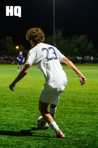 Caden Johannsen, (23) a Rio Rancho senior dribbles the ball during matchup against La Cueva in the APS Metro Soccer championships semifinals round.