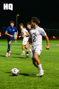 Rio Rancho’s Jude Duran, (2) a senior, analyzes the field while maintaining possession of the ball during a semifinals matchup against La Cueva in the APS Metro Soccer Championships semifinals round at the APS Soccer Complex.