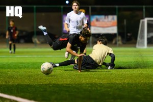 Kevin Trejo (10) of Rio Grande takes a tumble over Atrisco Heritage Academy’s goalkeeper which resulted in a red card for the keeper during their matchup against each other in the semifinals round of the APS Metro Soccer Championships.