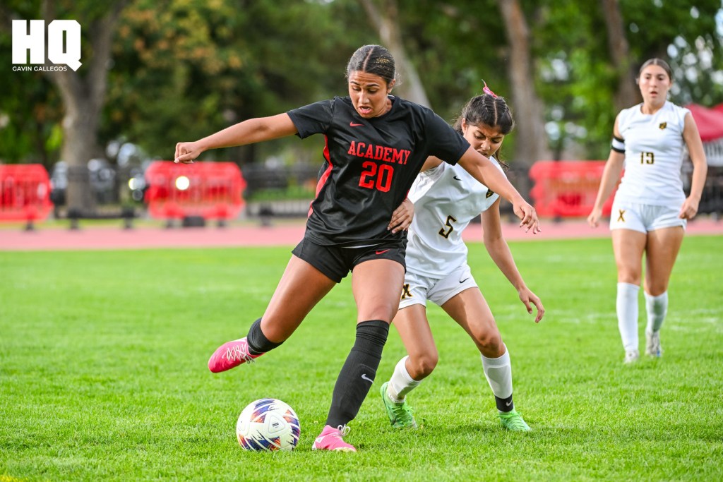 Xavi Vranka (20) of Albuquerque Academy defends against St. Pius X’s Genesis Guajardo (5) to maintain possession in a non-district matchup at Richard Harper Memorial Field on the campus of Albuquerque Academy. Gavin Gallegos/HQ Sports