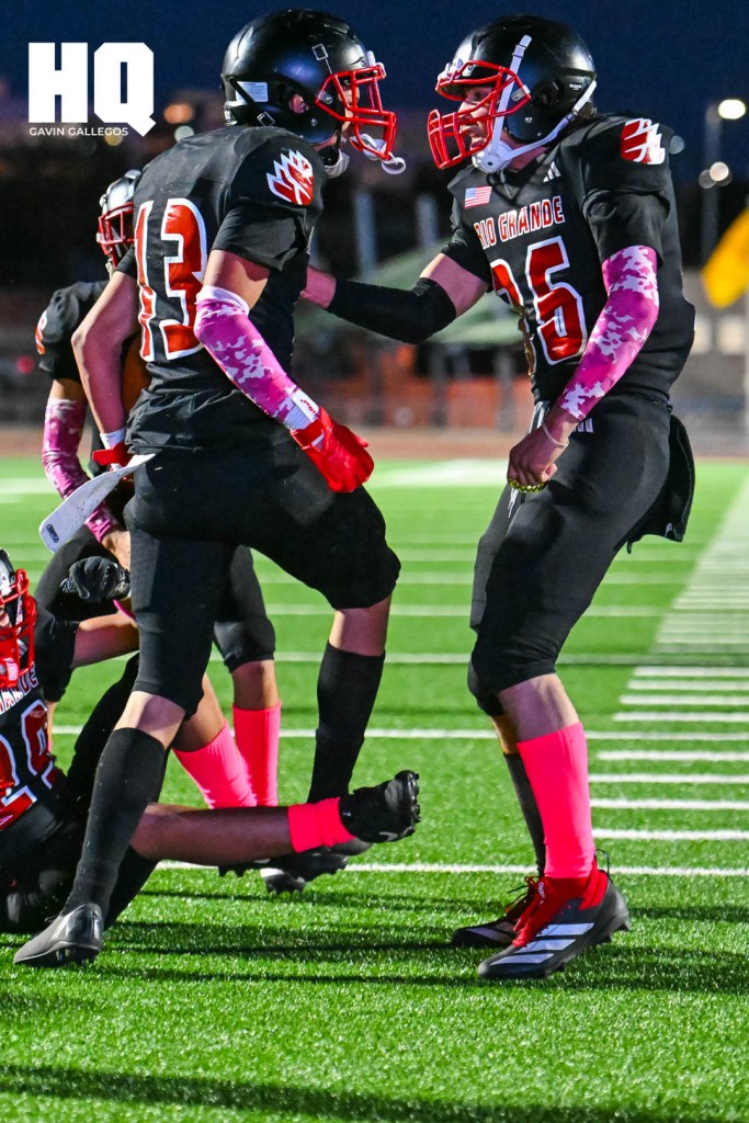 Following his interception, Fernando Gonzales (13) of Rio Grande celebrates alongside his teammate during their district game against Del Norte at Milne Stadium on October 3, 2025. Gavin Gallegos/HQ Sports