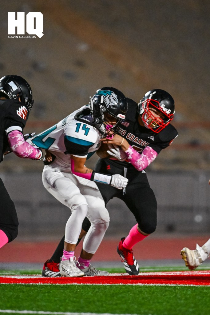Isaac Alatriste (14) of Del Norte evades a tackle to advance the ball while a Rio Grande defender attempts to take away the ball in their district matchup at Milne Stadium. Gavin Gallegos/HQ Sports