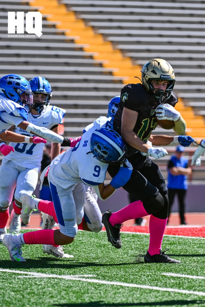 St. Michael’s Karsen Patten (9) stops Hope Christian’s advancement of the ball during a matchup against each other at Wilson Stadium in Albuquerque, NM. Gavin Gallegos/HQ Sports