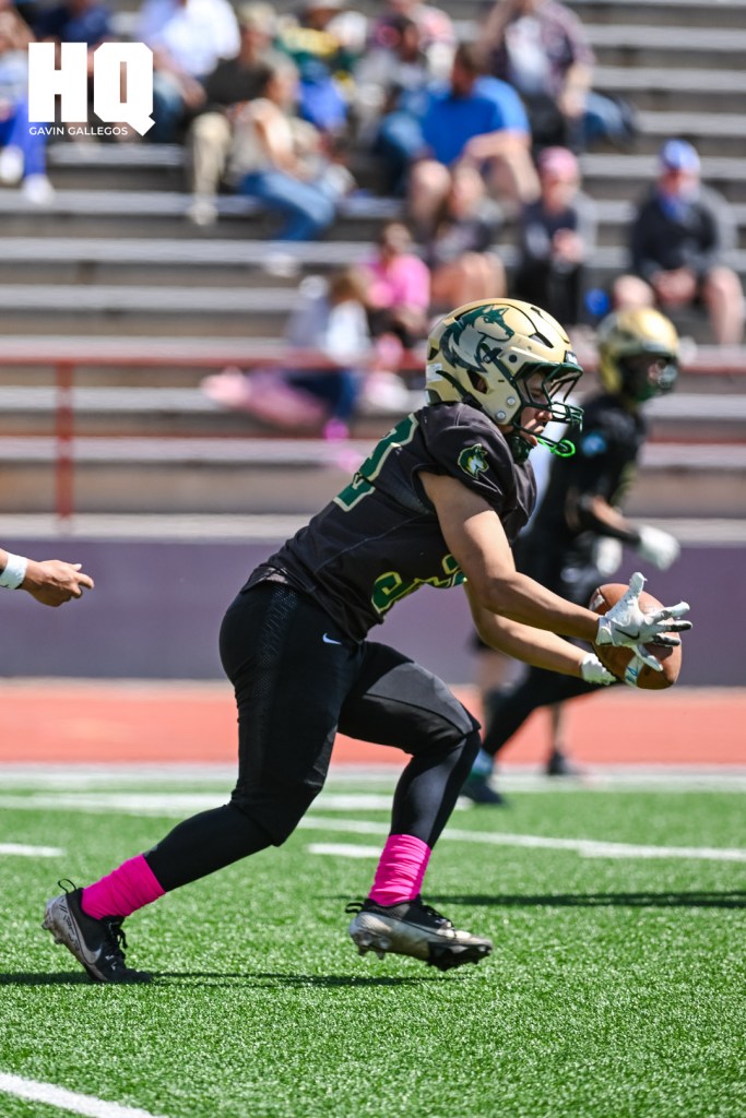 Following a kickoff return, a Hope Christian player fumbles with the ball during a district game against St. Michael's at Wilson Stadium in Albuquerque, NM. Gavin Gallegos/HQ Sports