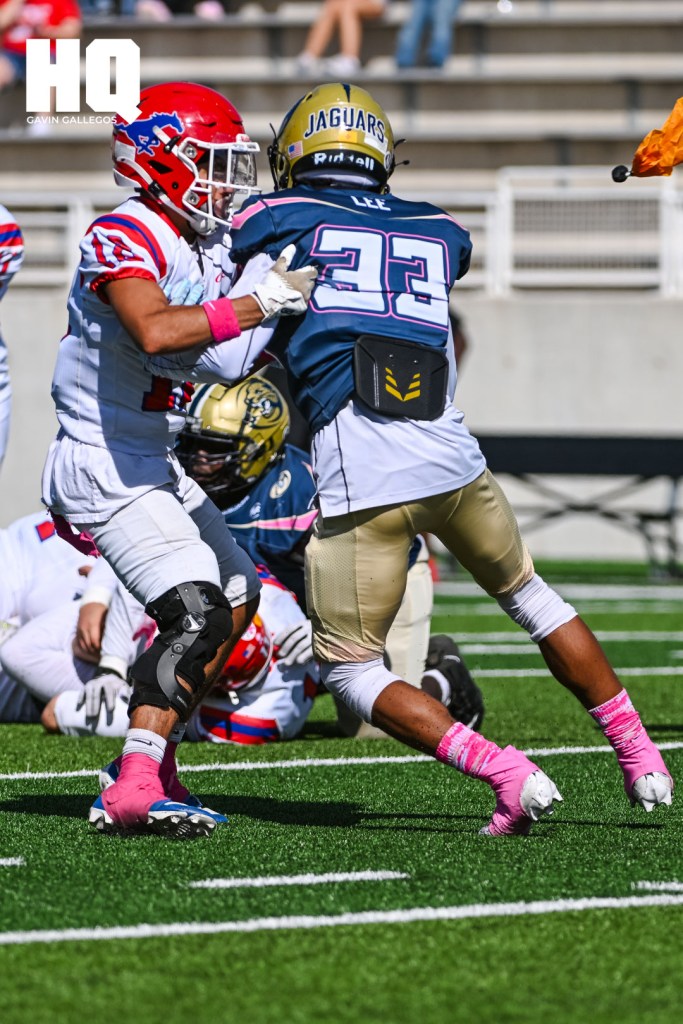 Atrisco Heritage Academy's Alijah Lee (33) tries to shed a block from a West Mesa player during a matchup against each other at Nusenda Community Stadium. Gavin Gallegos/HQ Sports