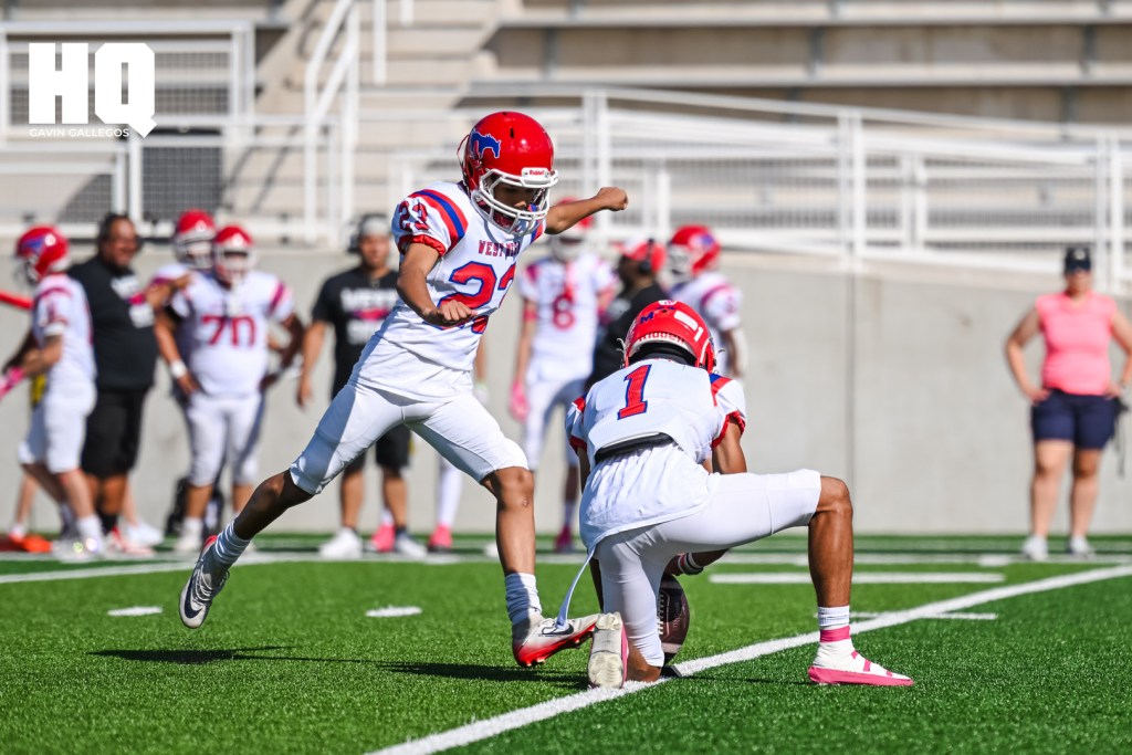 Carter Camacho of West Mesa kicks the ball in an attempt to score the mustangs an extra point following a touchdown in his district game against Atrisco Heritage Academy at Nusenda Community Stadium. Gavin Gallegos/HQ Sports